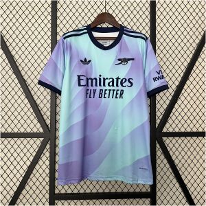 Mens Arsenal Third Jersey 2024/25 on display rack showing lilac and mint green wave gradient body with dark navy collar