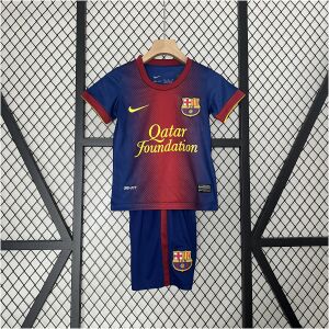 Kids Barcelona Retro Home Kit 2012/13 Kids Barcelona retro home jersey with red gradient panel and gold sponsor front view