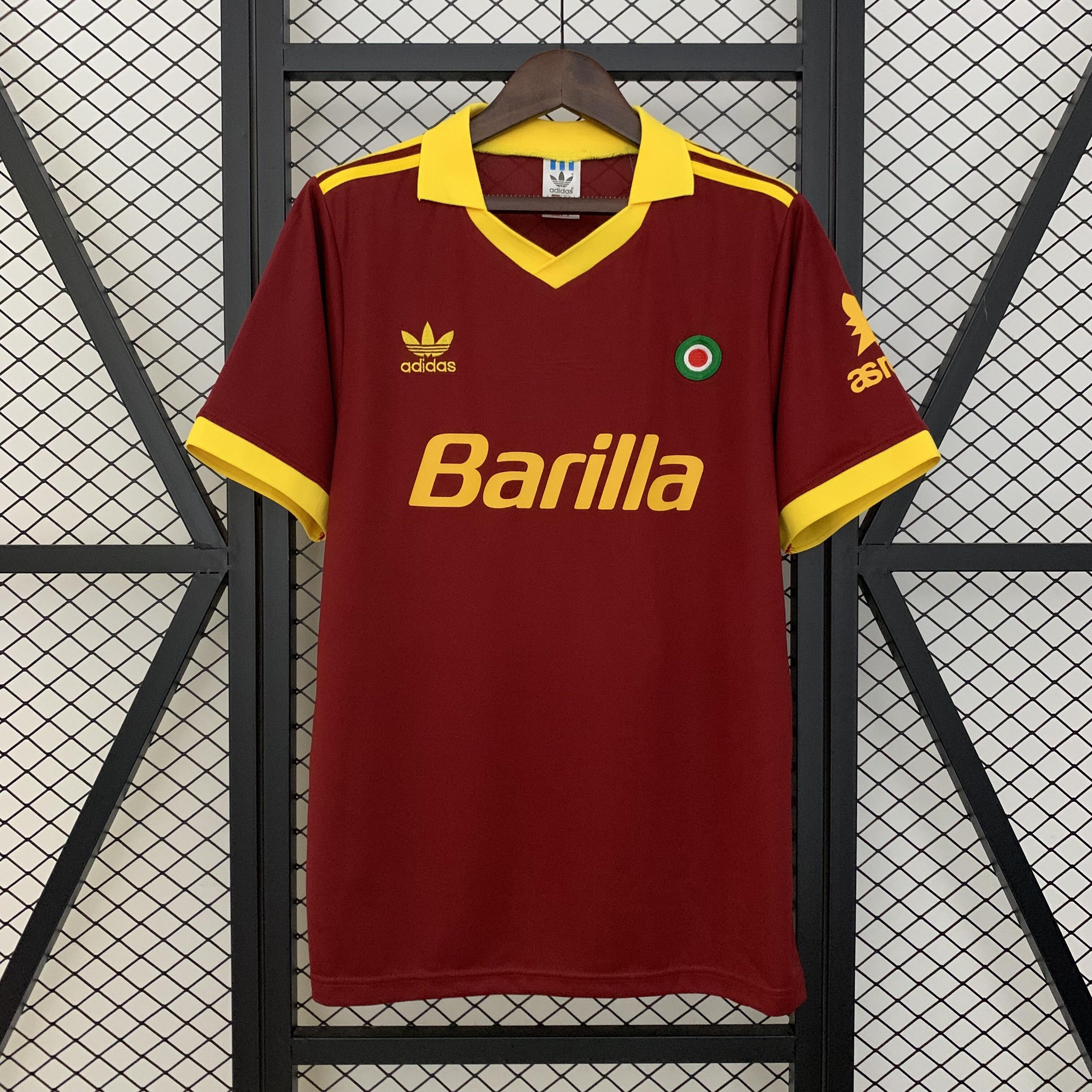 Mens Roma Retro Home Jersey 1991/92 Mens Roma Retro Home Jersey 1991/92 on hanger showing carmine red body with yellow polo collar