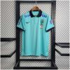 Mens World Cup Brazil Light Blue Polo 2022 on hanger showing aqua body with navy polo collar