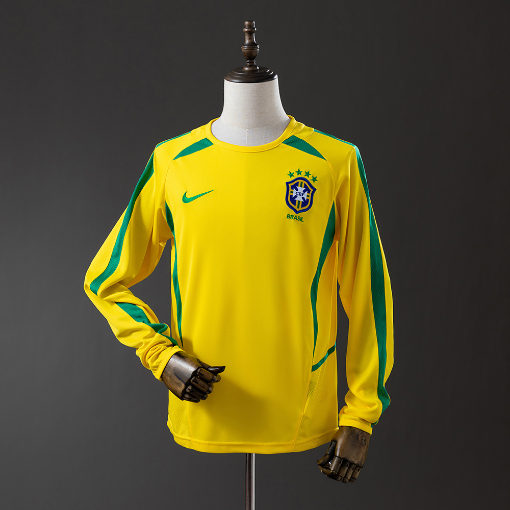 Mens World Cup Brazil Retro Long Sleeve Home Jersey 2002 Mens World Cup Brazil Retro Long Sleeve Home Jersey 2002 front view on mannequin displaying green contour panels