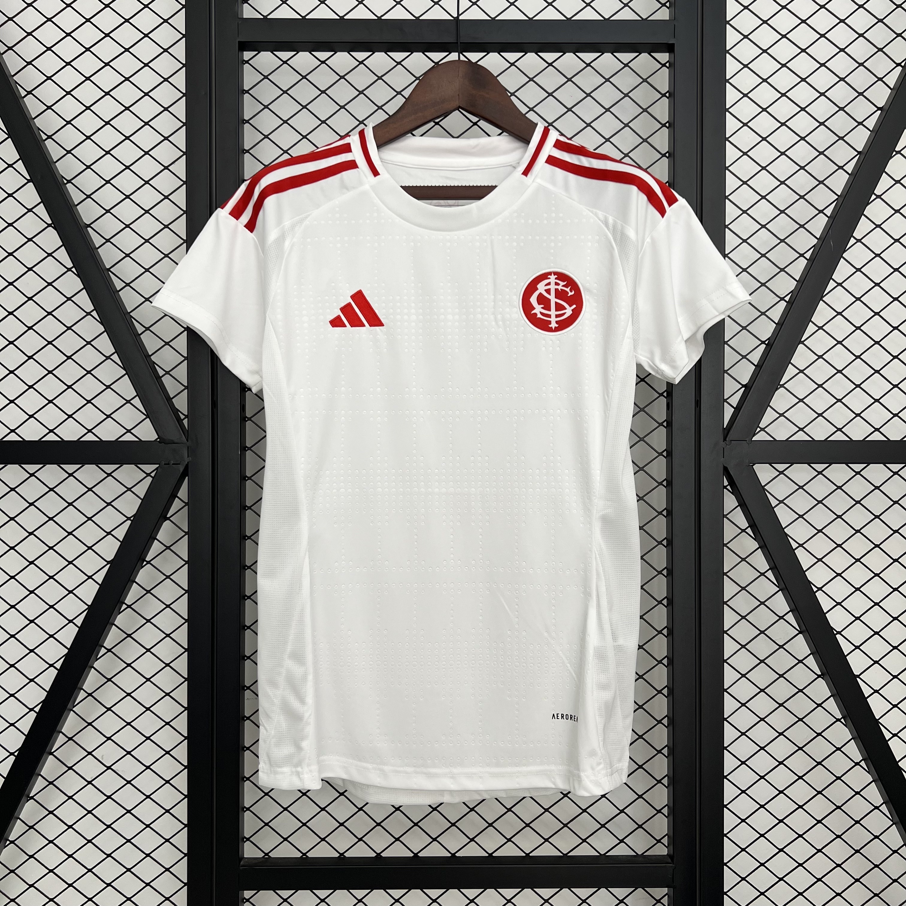 Womens Brazil International Away Jersey 2025 Womens Brazil International Away Jersey 2025 front view on hanger showing white body and red shoulder stripes