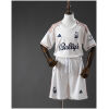 Kids Nottingham Forest Away Kit 2025/26 set flat lay showing off-white jersey with copper stripes and white shorts