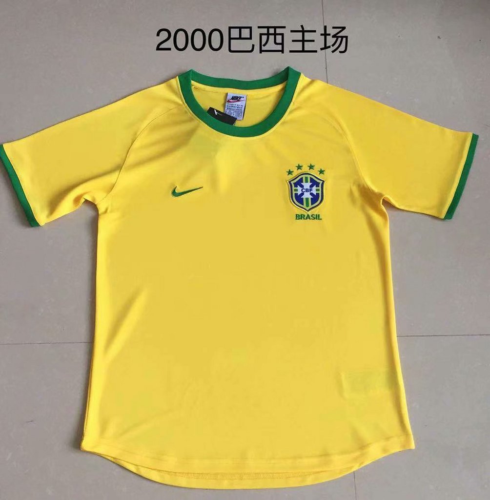 Mens Brazil Yellow Retro Home Jersey 2000 Mens Brazil Yellow Retro Home Jersey 2000 on hanger showing yellow body with wide green cuffs