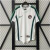 Mens World Cup Nigeria Retro Away Jersey 1998 on hanger showing white fabric and green flank stripes