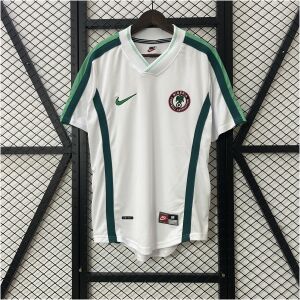 Mens World Cup Nigeria Retro Away Jersey 1998 Mens World Cup Nigeria Retro Away Jersey 1998 on hanger showing white fabric and green flank stripes