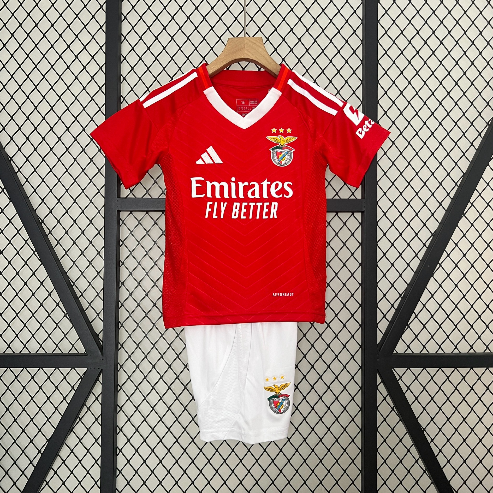 Kids Benfica Home Kit 2024/25 Kids Benfica Home Kit 2024/25 front view showing red shirt and white shorts