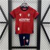 Kids Osasuna Home Kit 2024/25 front view on display