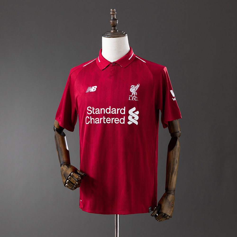 Mens Liverpool Retro Home Jersey 2018/19 Mens Liverpool Retro Home Jersey 2018/19 on mannequin showing deep red body with polo collar and white Standard Chartered sponsor