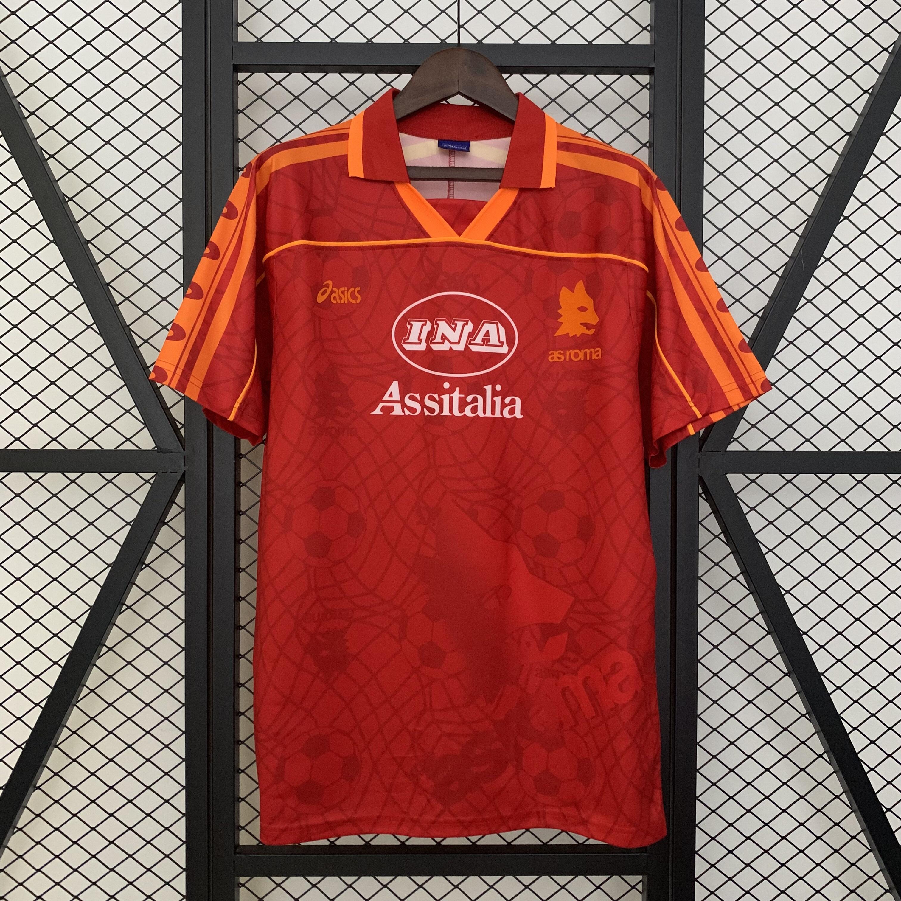 Mens Roma Retro Home Jersey 1995/96 Mens Roma Retro Home Jersey 1995/96 on hanger showing carmine red body with Lupetto jacquard weave