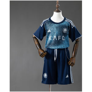 Kids Al Nassr Away Kit 2025/26 Kids Al Nassr Away Kit 2025/26 front view showing navy patterned jersey and shorts