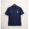 Mens World Cup France Home Jersey 2022 front view on hanger showing midnight navy base and gold crest