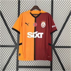 Mens Galata Home Jersey 2024/25 on display showing orange and maroon halves with black center stripe and SIXT logo