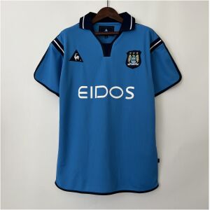 Mens Manchester City Retro Home Jersey 2001/02 on hanger showing sky blue body with navy collar and white EIDOS sponsor