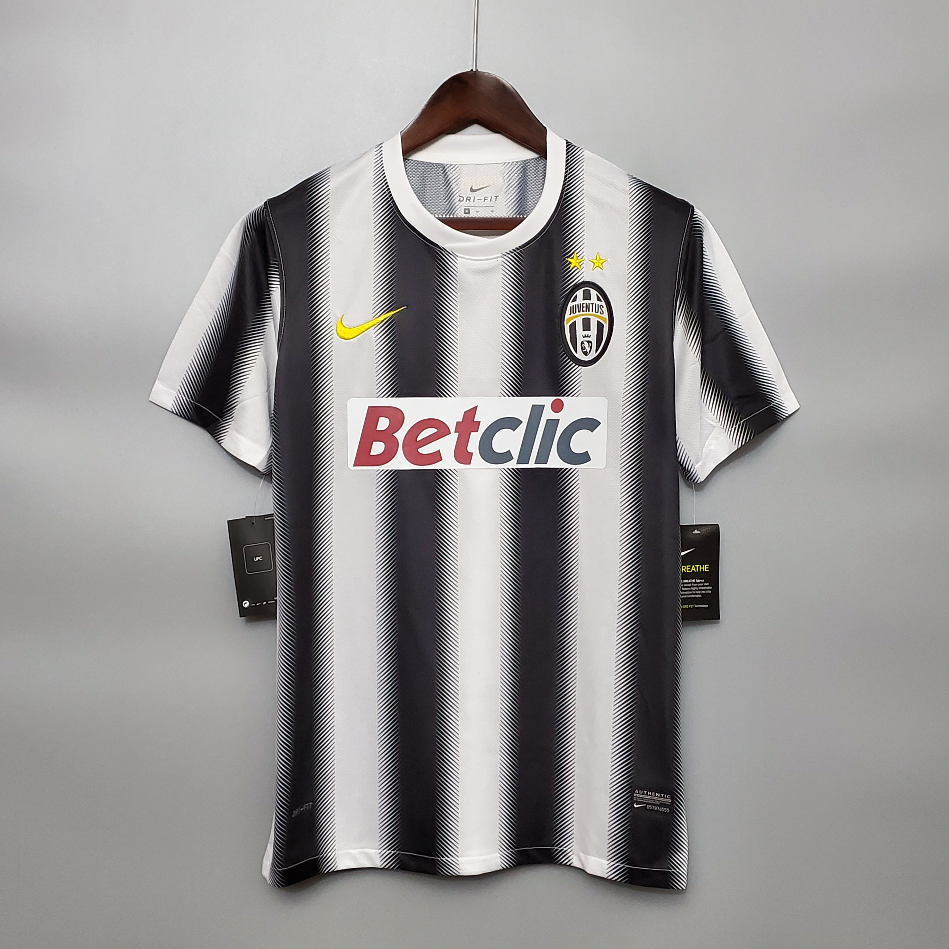 Mens Juventus Retro Home Jersey 2010/11 Mens Juventus Retro Home Jersey 2010/11 on hanger showing black and white zigzag lightning stripes
