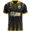 Black AEK Athens away jersey with gold mosaic bands and yellow collar front view