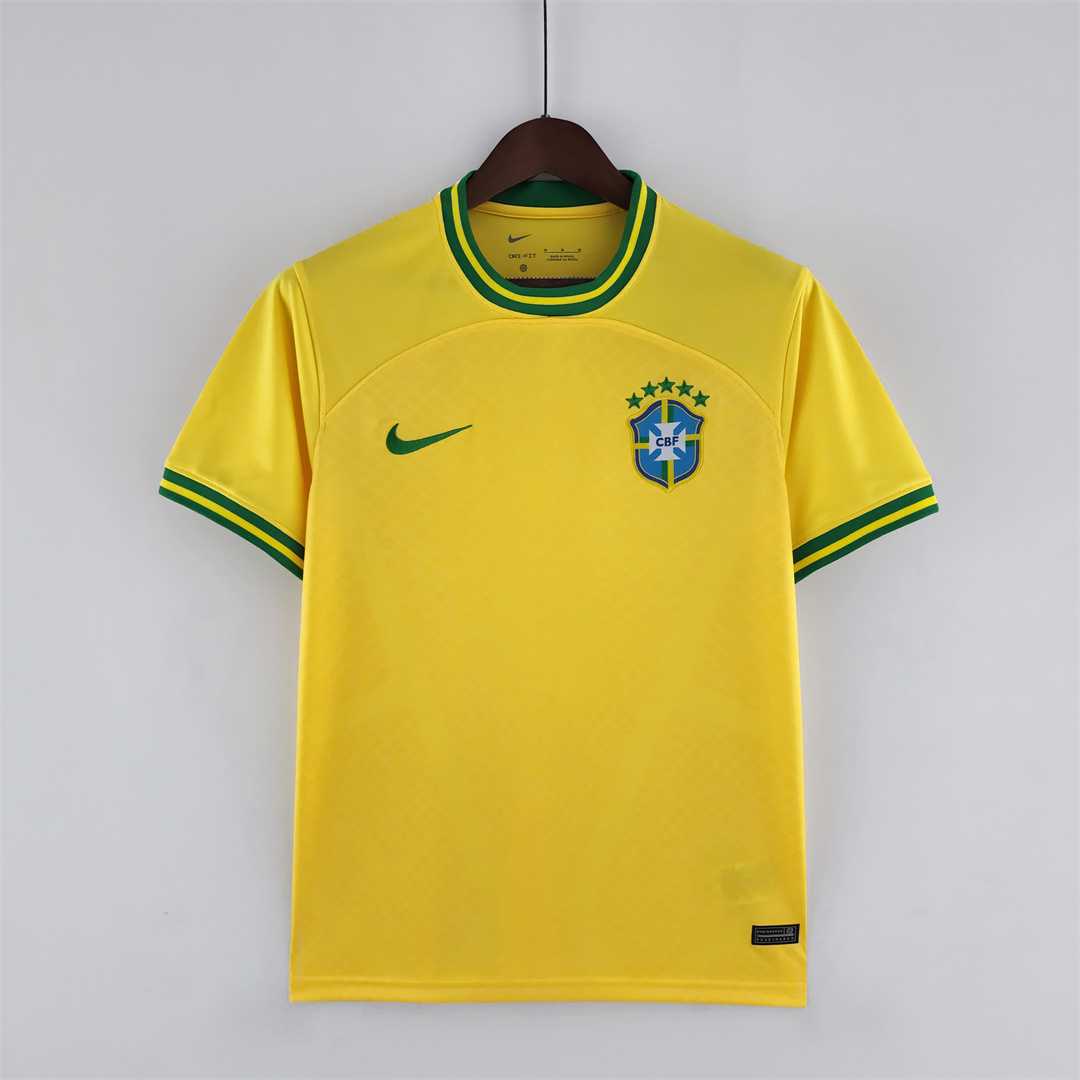 Mens World Cup Brazil Concept Yellow Jersey 2022 Mens World Cup Brazil Concept Yellow Jersey 2022 on hanger showing yellow body with striped green cuffs