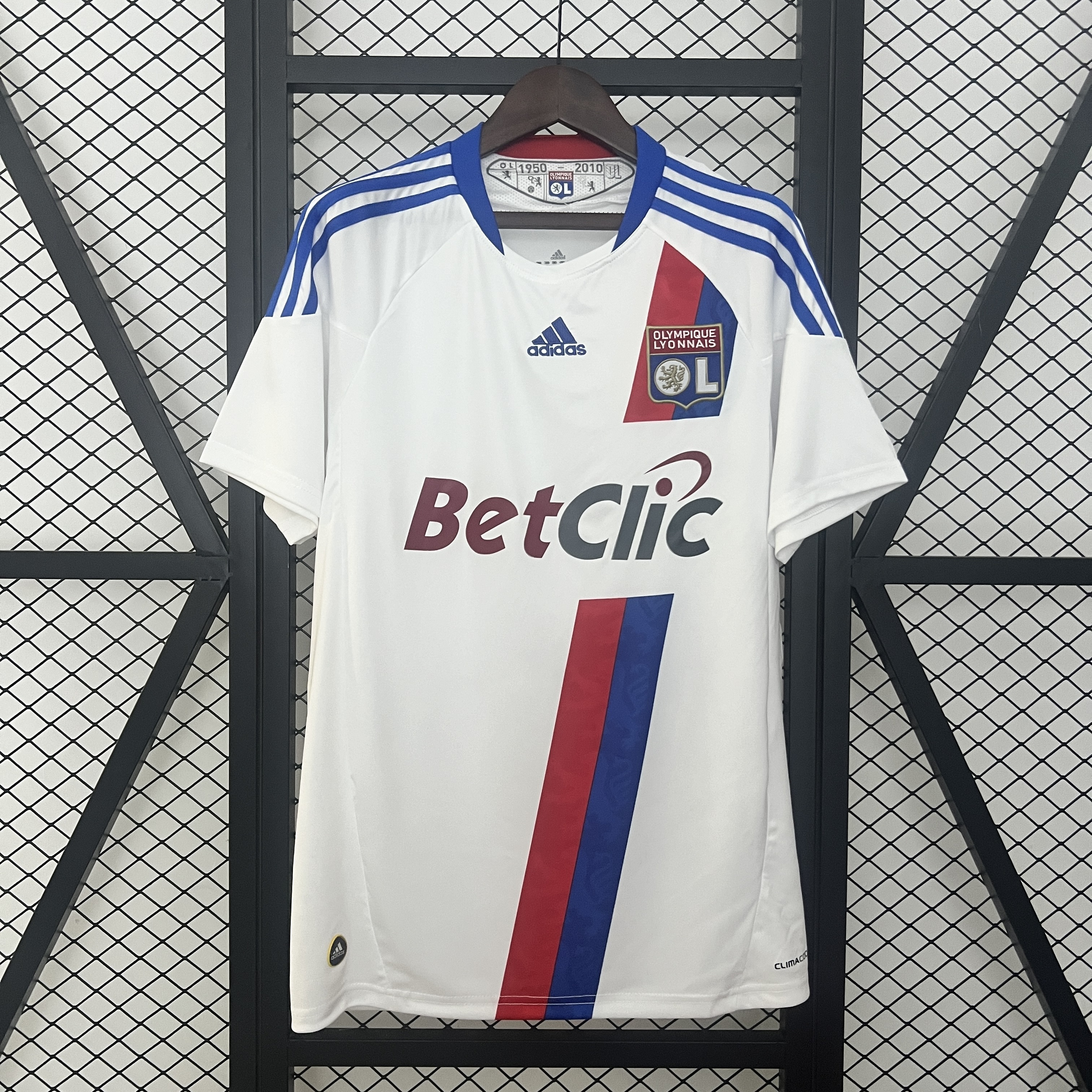 Mens Lyon Retro Home Jersey 2010/11 Mens Lyon Retro Home Jersey 2010/11 on hanger showing white body and red-blue diagonal split sash