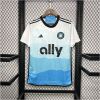 Mens Charlotte Home Jersey 2024/25 on hanger showing white-to-blue topographic wave gradient with ally logo