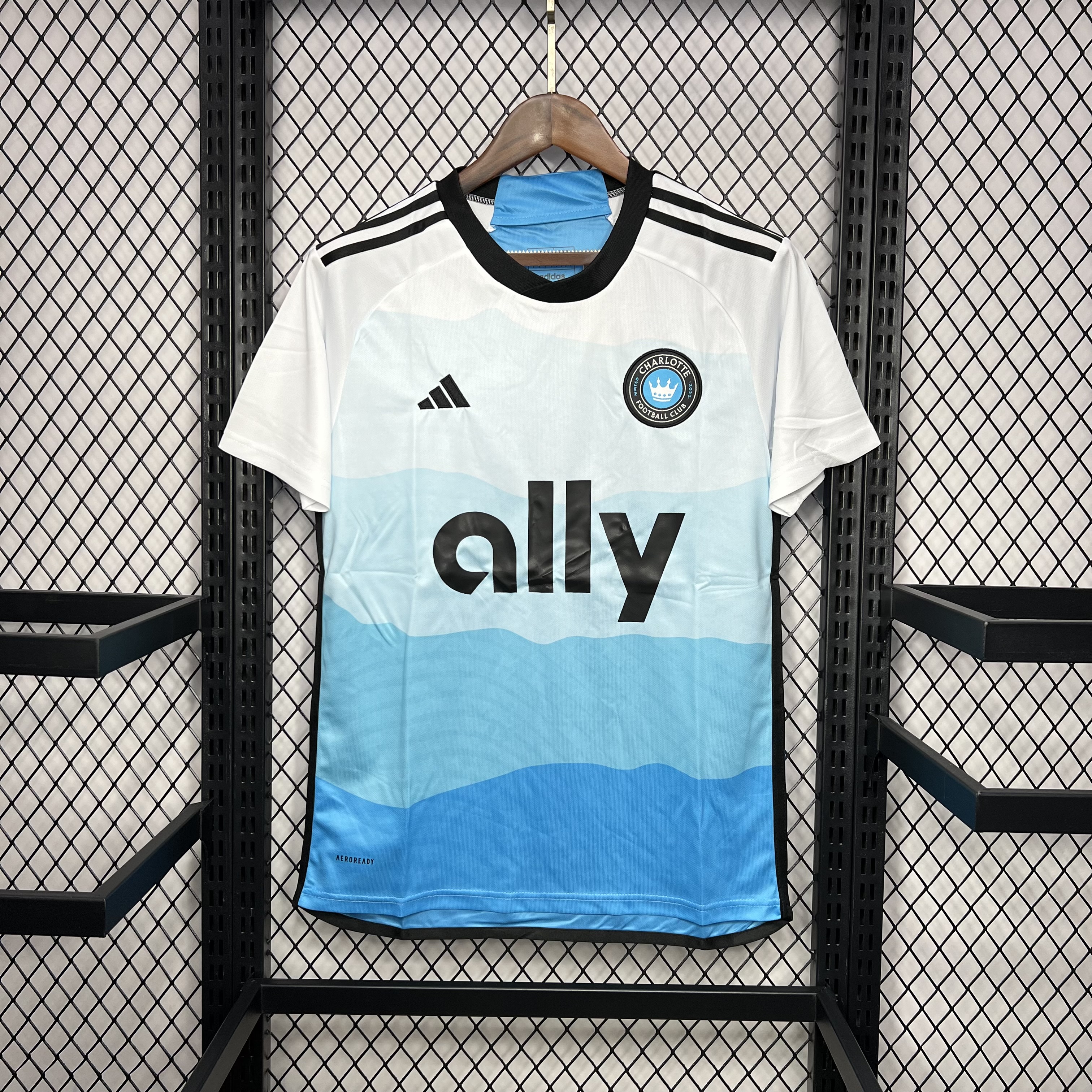 Mens Charlotte Home Jersey 2024/25 Mens Charlotte Home Jersey 2024/25 on hanger showing white-to-blue topographic wave gradient with ally logo