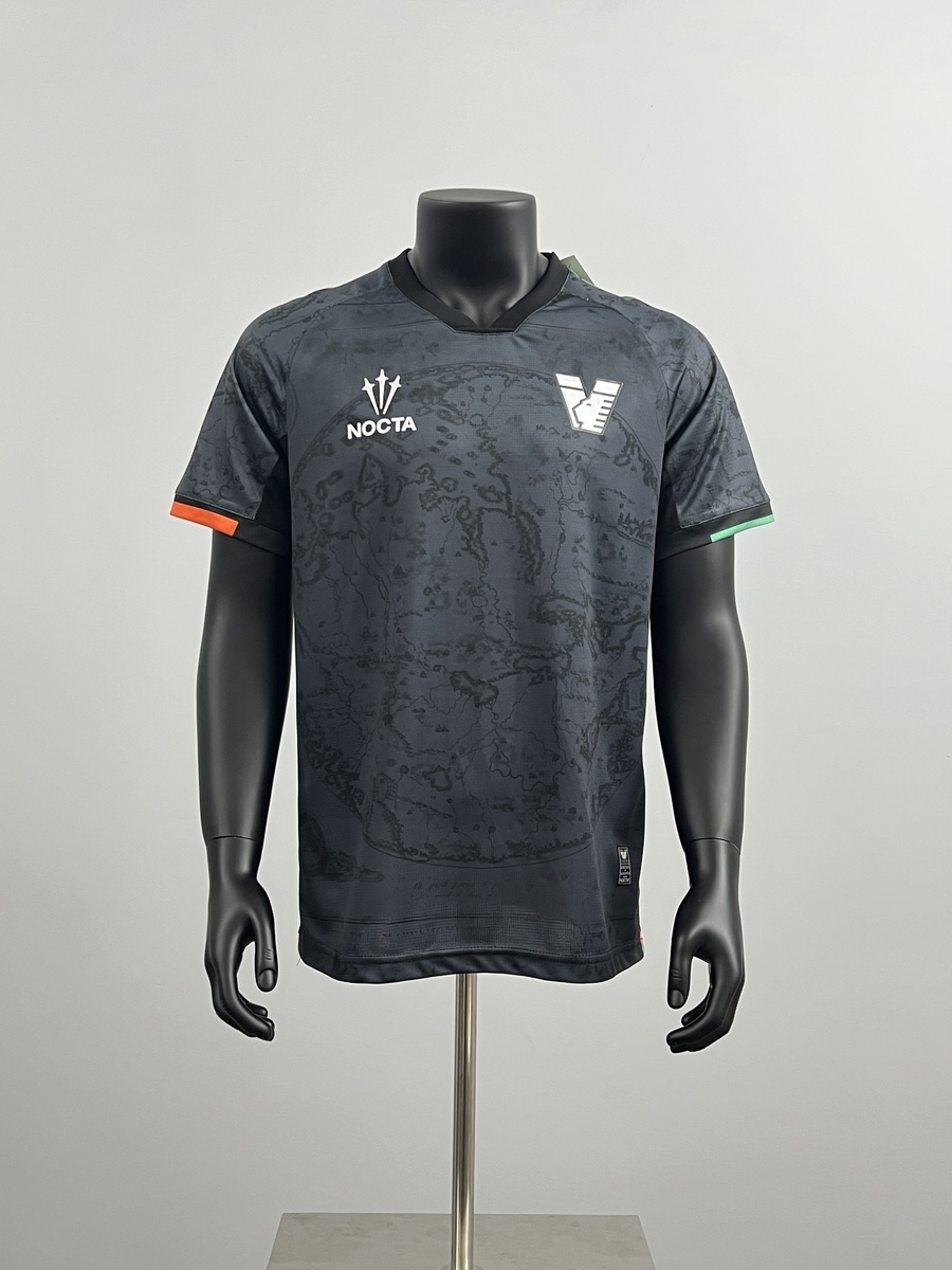 Mens Venezia Home Jersey 2025/26 Mens Venezia Home Jersey 2025/26 on mannequin showing charcoal black base and antique map illustration