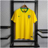 Mens World Cup Brazil Retro Home Jersey 2018 on hanger showing Samba Gold yellow body and green collar
