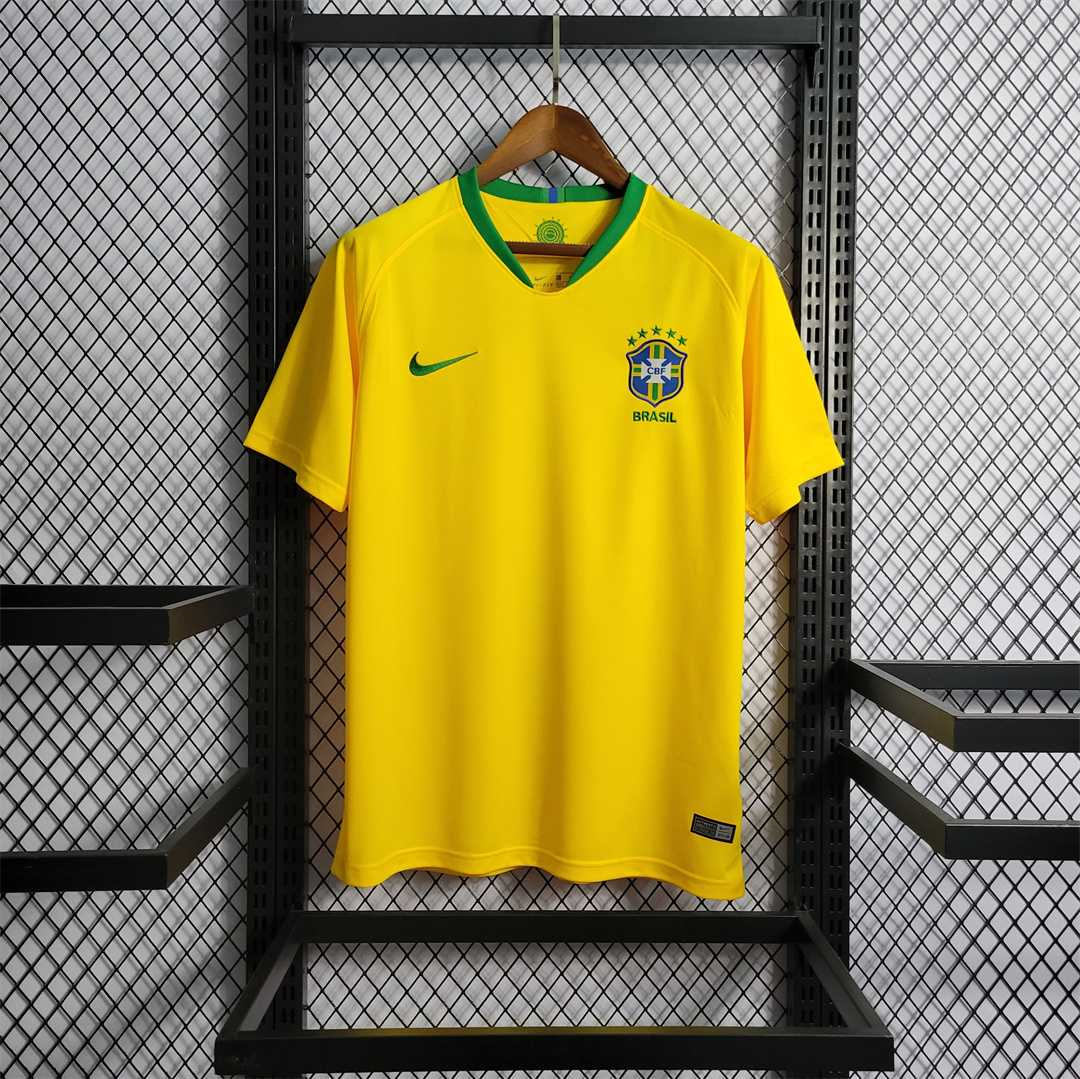 Mens World Cup Brazil Retro Home Jersey 2018 Mens World Cup Brazil Retro Home Jersey 2018 on hanger showing Samba Gold yellow body and green collar