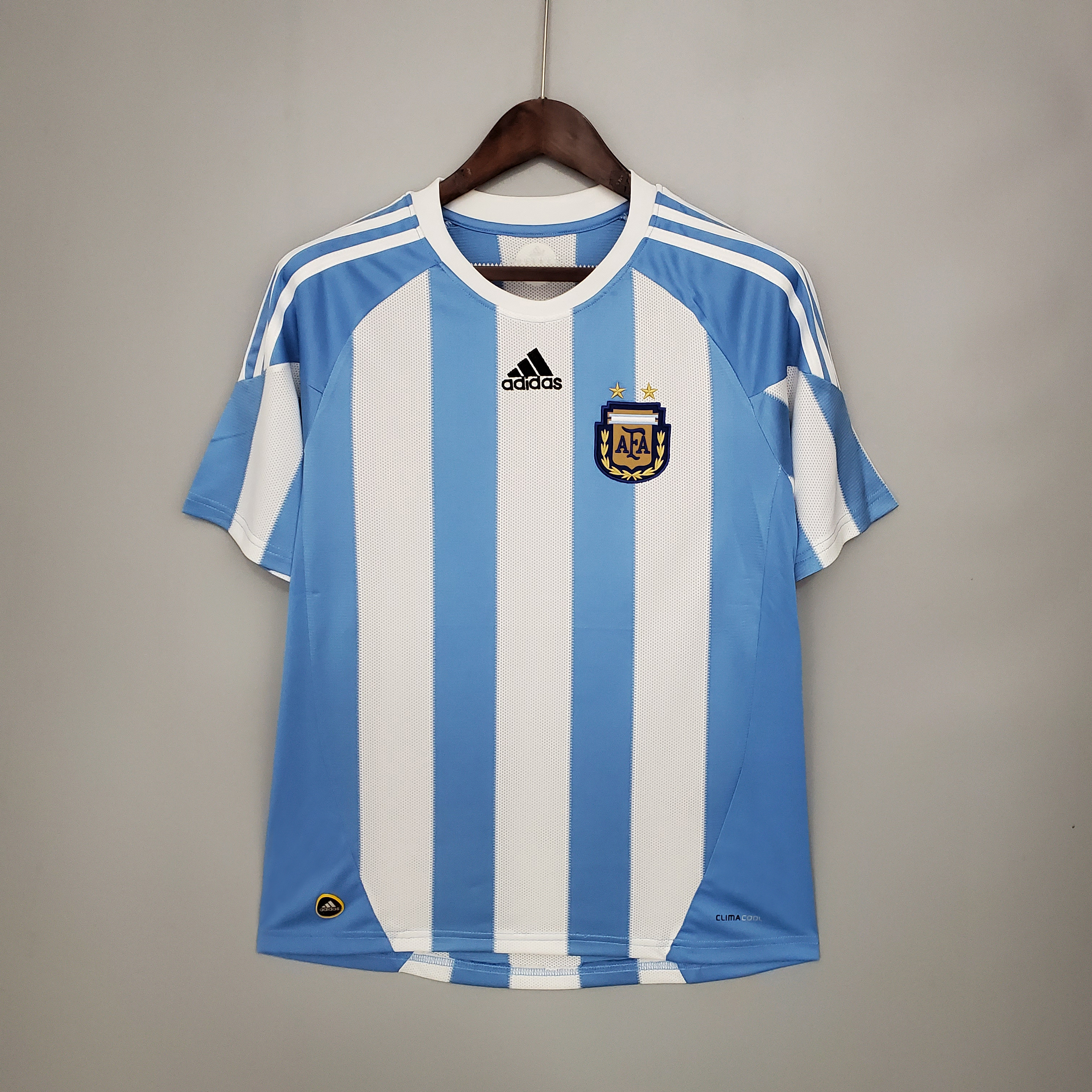 Mens World Cup Argentina Retro Home Jersey 2010 Mens World Cup Argentina Retro Home Jersey 2010 on hanger showing sky blue sleeves and Albiceleste stripes