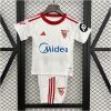 Kids Sevilla Home Kit 2025/26 front view on display