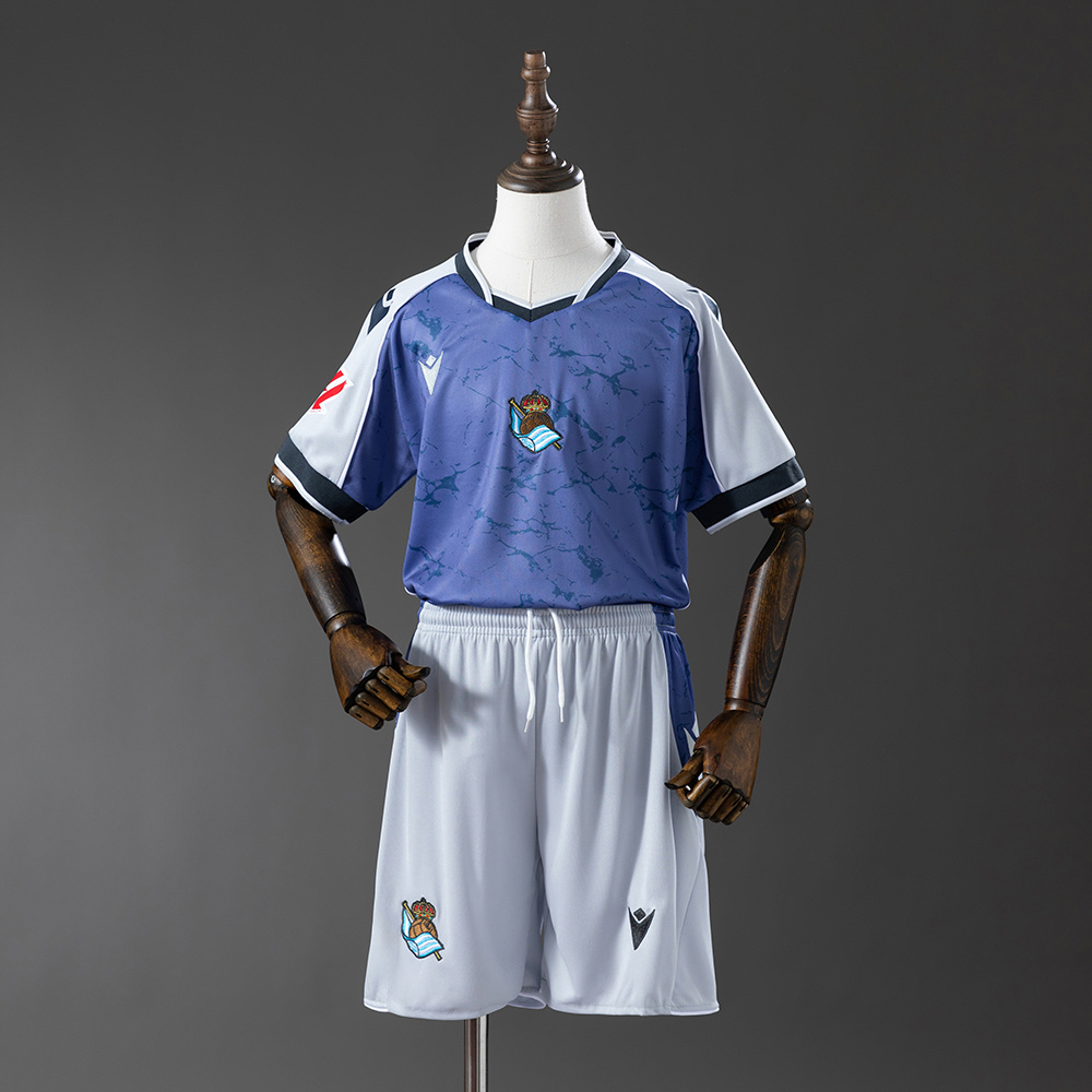 Kids Real Sociedad Game Away Kit 2025/26 Kids Real Sociedad Game Away Kit 2025/26 front view on display