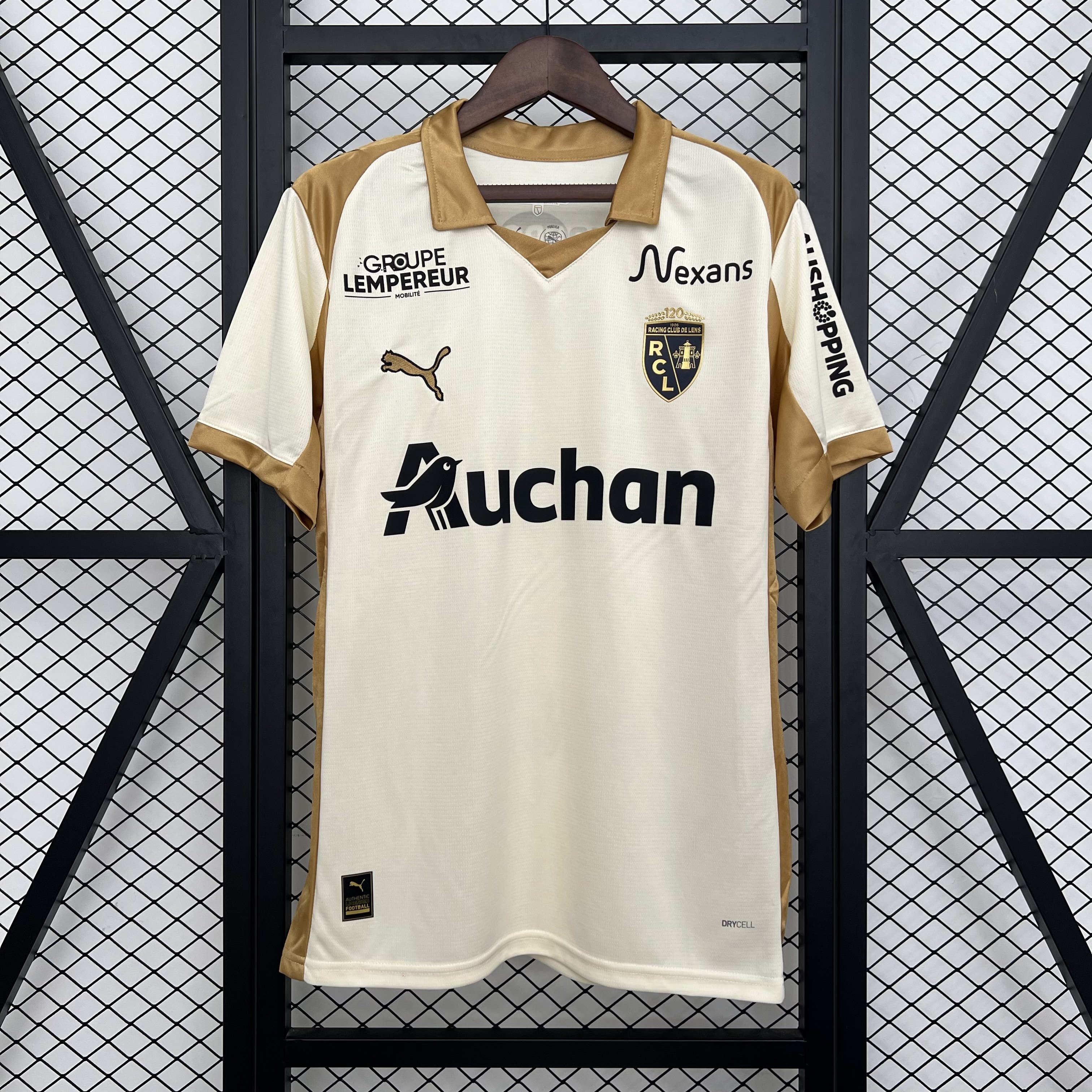 Mens Lens Third Jersey 2025/26 Mens Lens Third Jersey 2025/26 on hanger showing ecru cream body with gold polo collar and 120th anniversary crest