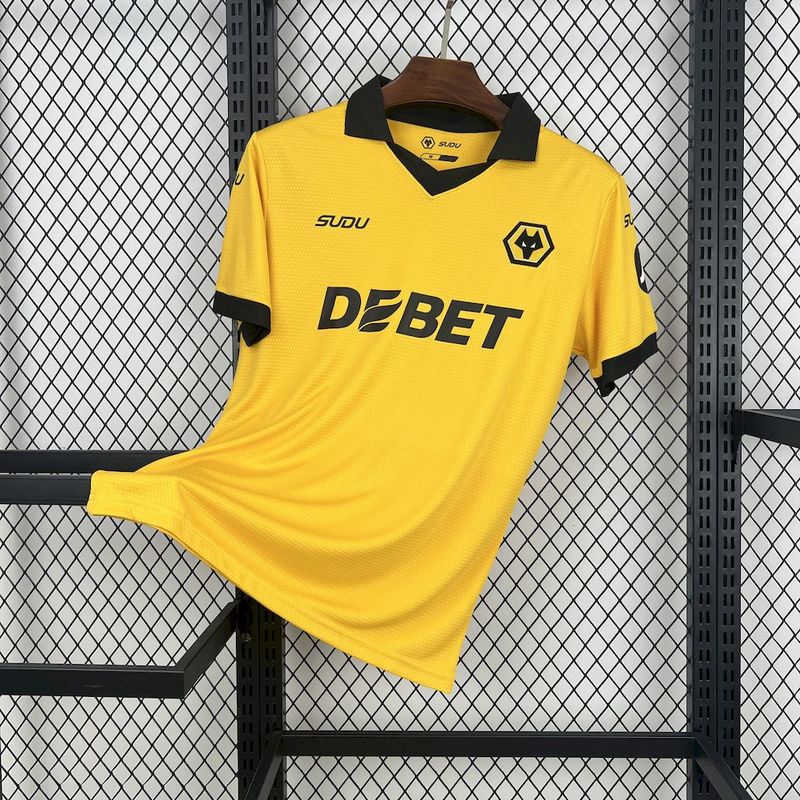 Mens Wolves Home Jersey 2025/26 Mens Wolves Home Jersey 2025/26 on hanger showing old gold amber knit with black polo collar and central crest