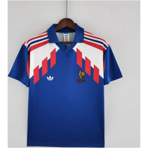 Mens France Retro Home Jersey 1988 Mens France Retro Home Jersey 1988 front view on hanger showing geometric shoulder panels and golden crest