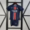 Kids PSG Champion Edition Home Kit 2024/25 showing youth jersey with gold star crest and matching navy shorts