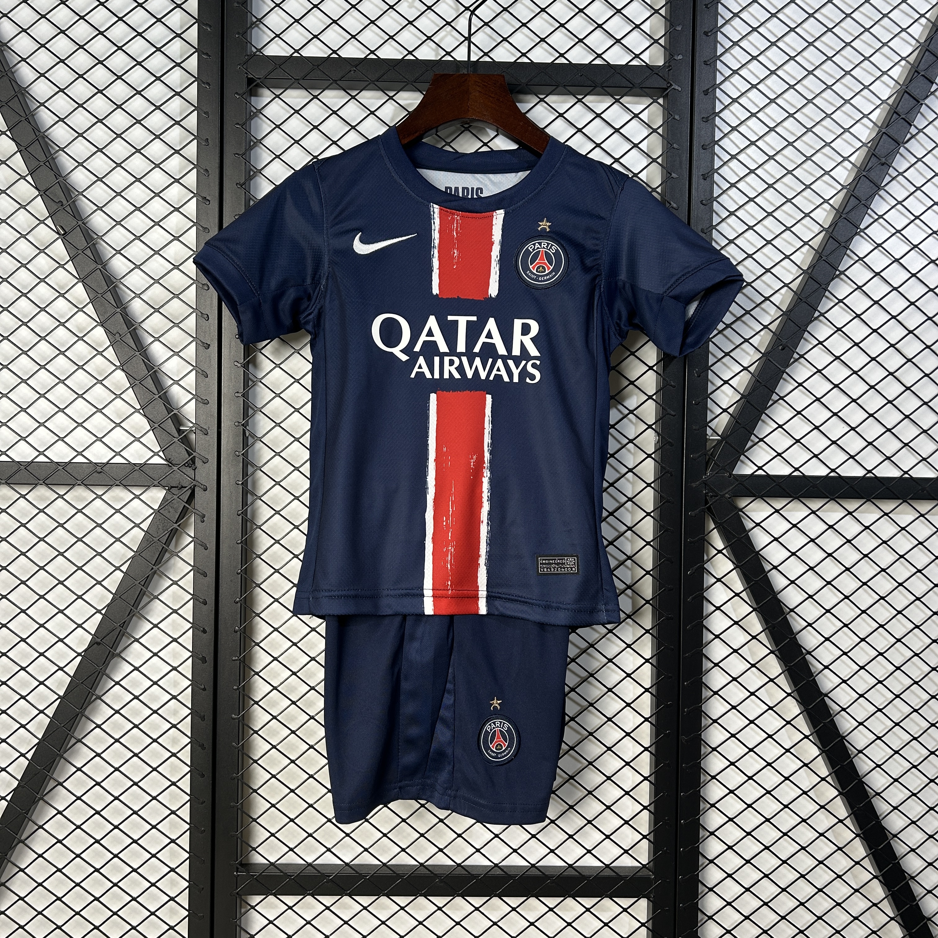 Kids PSG Champion Edition Home Kit 2024/25 Kids PSG Champion Edition Home Kit 2024/25 showing youth jersey with gold star crest and matching navy shorts