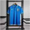 Mens World Cup Brazil Blue Polo 2022 on hanger showing blue pique body with yellow-tipped collar