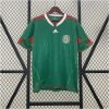 Mens World Cup Mexico Retro Home Jersey 2010 on mannequin showing emerald green base and red trim