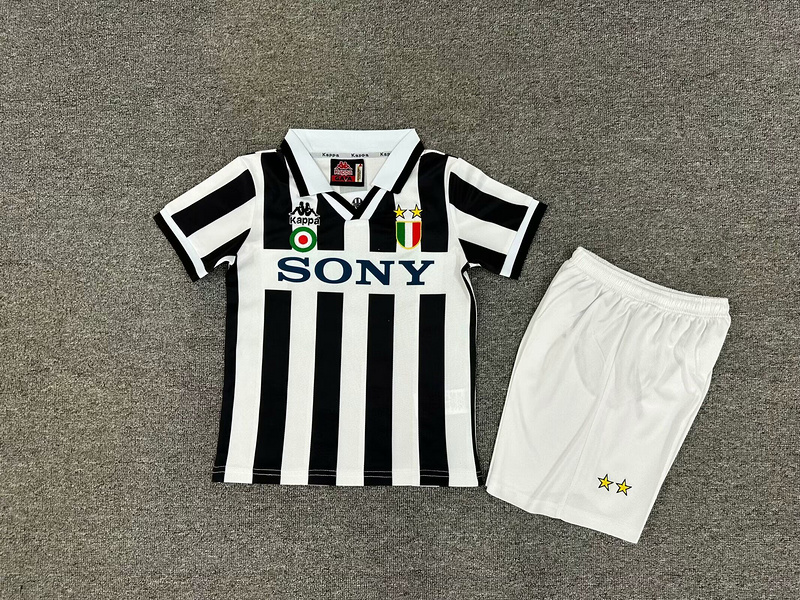 Kids Juventus Retro Home Kit 1995/96 Kids Juventus Retro Home Kit 1995/96 laid flat showing striped jersey and matching white shorts