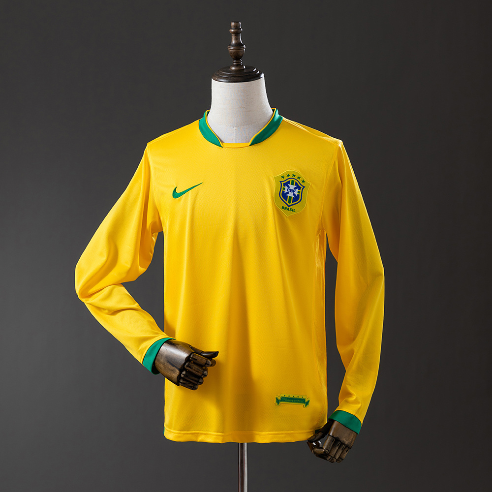 Mens World Cup Brazil Retro Long Sleeve Home Jersey 2006 Mens World Cup Brazil Retro Long Sleeve Home Jersey 2006 front view on mannequin showing yellow long-sleeve body