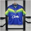 Mens Brazil Corteiz Retro Away Jersey 1995 on hanger showing blue body with lime green saw-tooth chevron graphics