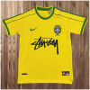 Mens World Cup Brazil Signed Edition Yellow Retro Home Jersey 1998 flat view showing yellow body and signature script