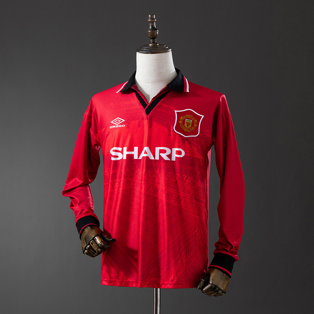 Mens Manchester United Retro Long Sleeve Home Jersey 1994/96 Mens Manchester United Retro Long Sleeve Home Jersey 1994/96 on mannequin showing red body with Old Trafford blueprint