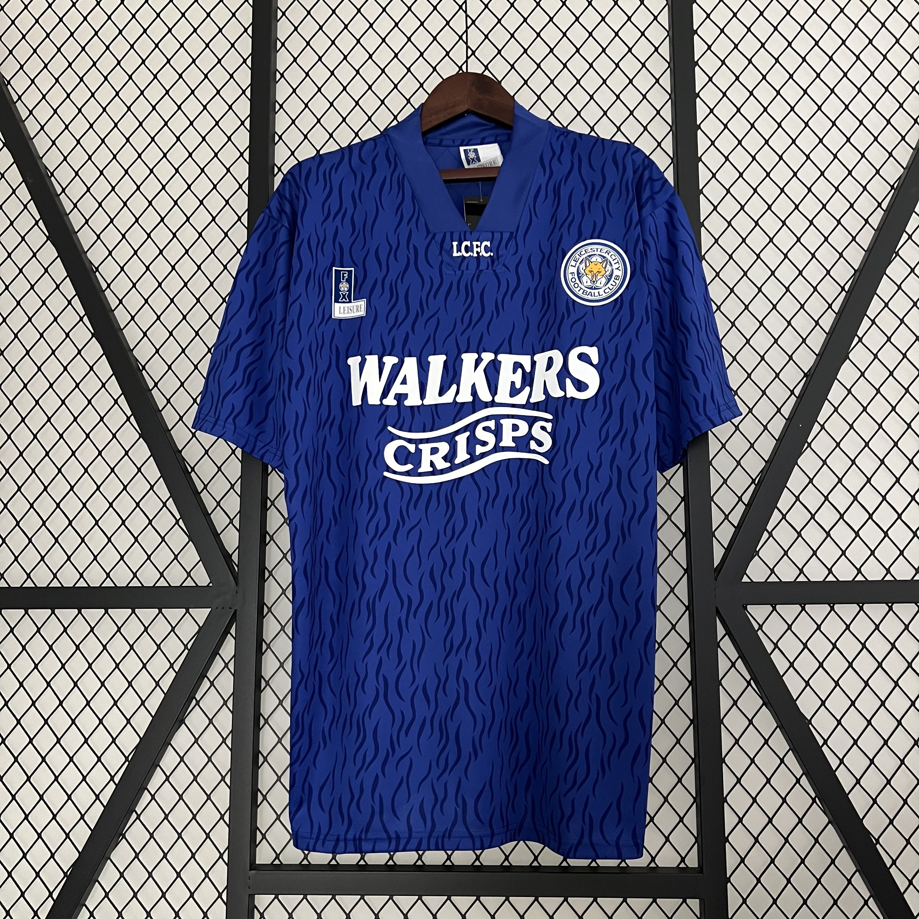 Mens Leicester City Retro Home Jersey 1992/94 Mens Leicester City Retro Home Jersey 1992/94 on hanger showing royal blue body with jacquard waves and WALKERS CRISPS sponsor