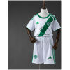 Kids Al/Ahli Saudi Away Kit 2025/26 on mannequin showing white jersey with green diagonal sash and shorts