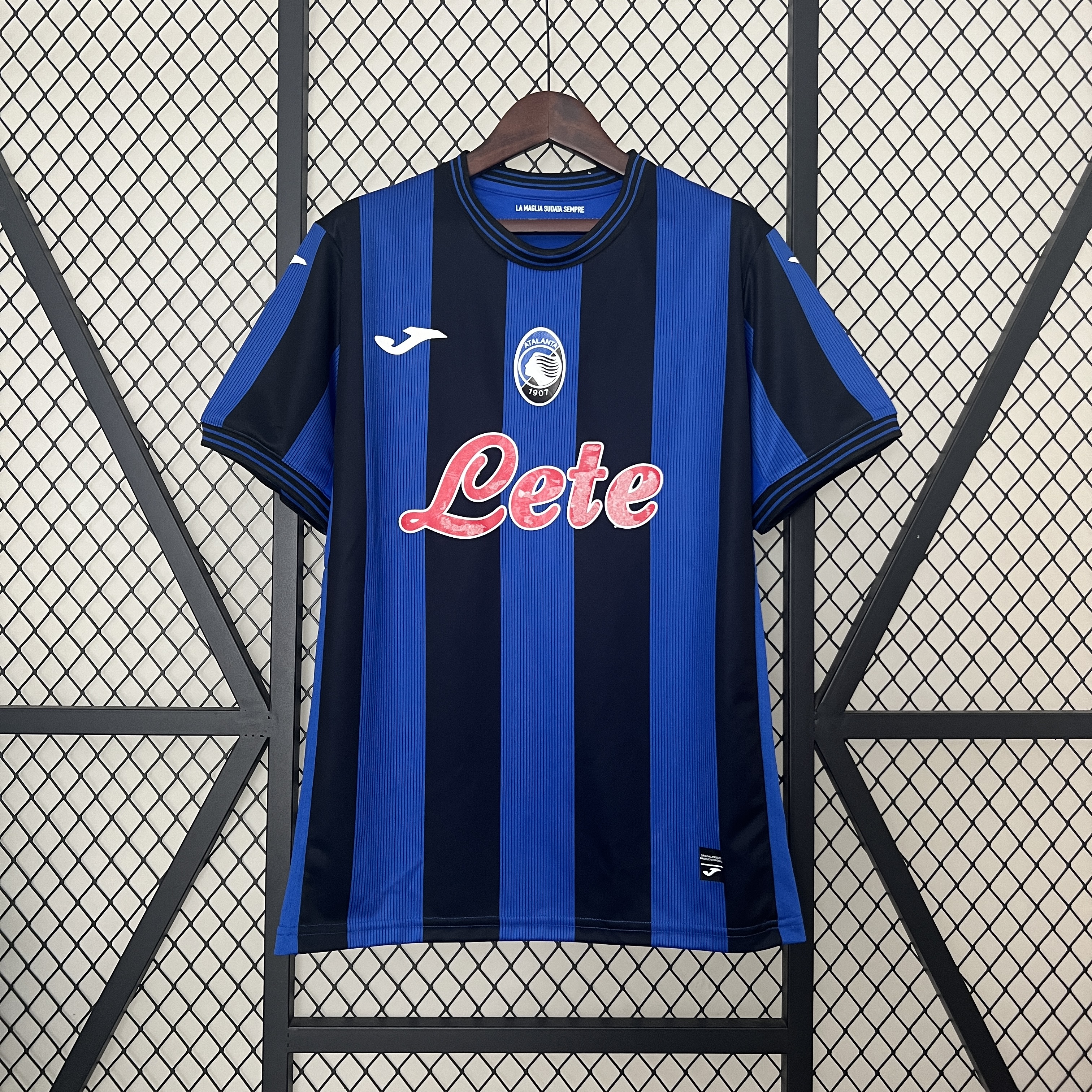 Mens Atalanta BC Home Jersey 2024/25 Mens Atalanta BC Home Jersey 2024/25 on hanger displaying royal blue and black stripes with oval club crest