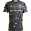 Front view of the Mens Columbus Crew Away Jersey 2025/26 displaying charcoal fabric with neon volt yellow drip graphics and Nationwide sponsor.