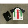 Kids Palestino Home Kit 2025/26 front view with tricolor jersey, keffiyeh sleeves, and black shorts