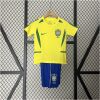 Front view of the Kids World Cup Brazil Retro Home Kit 2002 featuring yellow jersey and royal blue shorts