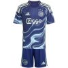Kids Ajax away kit navy shirt with sky-blue marbled wave print front view