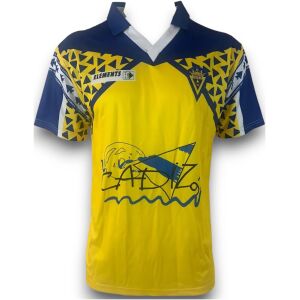 Bright yellow jersey with navy yoke, zigzag print and crowned crest, front view
